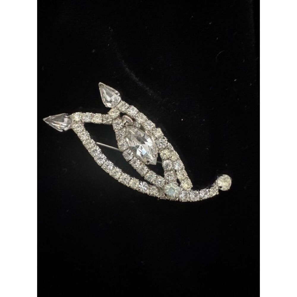 Vintage clear rhinestone leaf/feather design brooch, silver-tone.